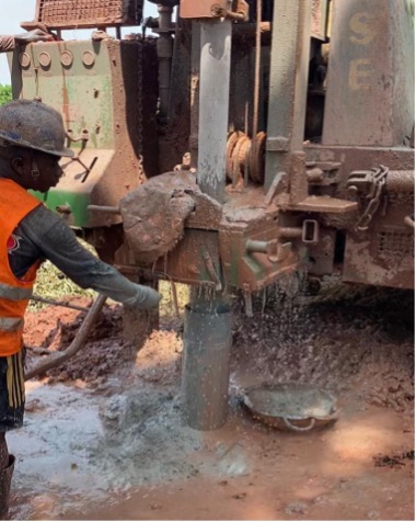 Borehole drilling with a DTH rig